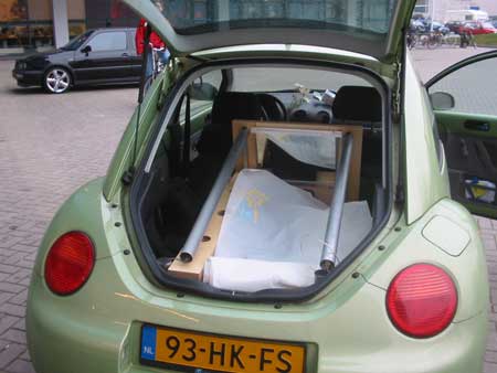 sticker 6: A picture of Cabinet in our car as it was ready to leave the ID-StudioLab for the design practice.     It shows how Cabinet can even be transported in a relatively small car. For the measurements of Cabinet we considered the fact that it had to be transported in our New Beetle.    This picture was taken on March 5, 2004 in front of the faculty building.    On flickr.com/photos/cabinet/sets/ are more pictures of Cabinet.